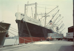 Freighter Unloading At A Dock In Newark, New Jersey, Red Star Trucking Co Trucks Receiving Freight by George French