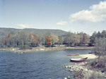 Rowboats Tied Up Along Shore Of A Stream Or Pond In Center Harbor, New Hampshire by George French