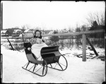 Young Child Sitting In A Sleigh by George French