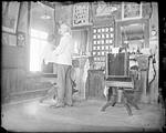 Interior View Of A Barber Shop by George French