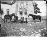 Two Men And A Woman With Two Horses And A Dog Outside Of A Home by George French