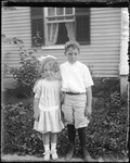 Portrait Of A Young Boy And Girl Outside Their Home by George French