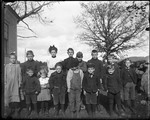 Group Of School Children And Teacher Posed Outside by George French