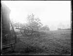 View Of A Two-wheeled Hay Cart Sitting Outside Of A Barn by George French