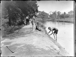 Scene Along A Canal Of People Walking On A Path And Boys Finishing A Swim by George French