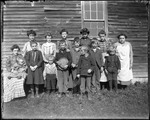 School Group And Teacher Outside Of Their School House by George French