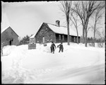 Two Boys Shoveling Snow At An Old Homestead by George French