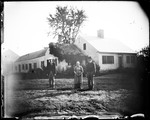 Three People Standing In Front Of A Large Rambling Farm House by George French