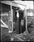 Full Length Portrait Of A Well Dressed Woman Standing In A Gate by George French