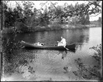 Two People In A Canoe On A Stream by George French