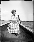 Woman (Alic) Paddling A Canoe by George French