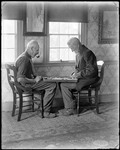 Two Men Playing Checkers By A Window by George French