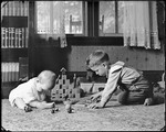 Young Boy And Baby Playing On The Floor by George French