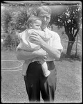 George French Holding A Small Child by George French