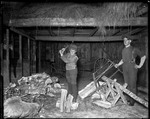 Two Young Men Sawing & Splitting Wood In A Barn by George French