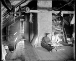 Two Young Men In An Attic Looking Through Memorabilia by George French