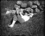 George French Laying On The Ground Next To A Stone Wall by George French