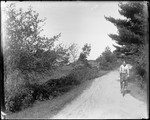 George French Riding A Bicycle On A Rural Road by George French