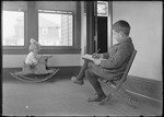 Little Girl In A Rocking Horse Being Sketched By A Young Boy Seated In A Chair by George French