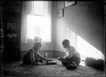 Young Boy And Girl Sitting On The Floor Playing With Blocks by George French