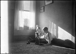 Young Boy And Girl Sitting On The Floor Playing With Blocks by George French