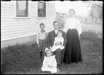 Family Of Five Posed Outside Their Home (Ellsworth Sawyer) by George French
