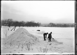 Two Children In A Field Building A Snow Igloo by George French