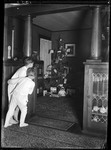 Two Children Peeking In At A Decorated Christmas Tree by George French
