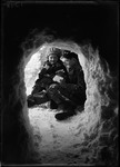 Two Children Sitting And Eating Bread In A Snow Cave by George French