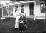 Elderly Man And Woman Posed Outside Their Home by George French