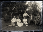Empire Grove 03: Three Women and Two Men Sitting by Fallen Tree, East Poland, ca. 1911