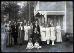 Empire Grove 13: Group of 20 People Posing by Cottage, East Poland, ca. 1911 by Mary Irish
