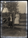 Empire Grove 22: Man and Woman Posing by Fence, East Poland, ca. 1911 by Mary Irish