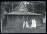 Empire Grove 44: Four Women in front of a Cottage, East Poland, ca. 1911