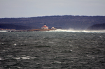 lighthouse in Frenchman Bay in big waves