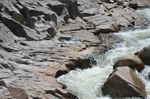 polished rock Wassataquoik Stream by Joseph Kelley