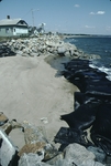 Sand bags closing seawall on beach