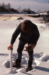 Craig Neil measuring water levels in winter