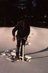 Craig Neil measuring water levels in winter