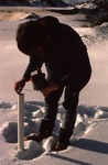 Craig Neil measuring water levels in the winter