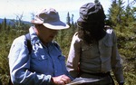Cornelia Cameron showing peat sampling field methods to Joe Russo (Mass. Geol. Survey) - Bog near E. Andover (450814) by Vernon L. Shaw