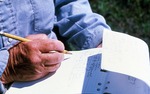 Cornelia Cameron making notes in Sidney Bog using official USGS notebook. (C3875) by Vernon L. Shaw