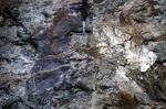 Lepidolite in Wall of Black Mtn. Quarry by Woodrow B. Thompson