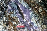 Lepidolite at Black Mtn. Quarry by Woodrow B. Thompson