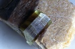 Orchard Quarry - Golden beryl crystal on feldspar. 24 x 12 mm; 10 x 5 cm overall. by John Poisson