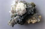 Orchard Quarry - Large specimen of milky quartz crystals on beryl (12 x 10 cm). by John Poisson