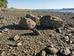 Granitic boulders on beach by Ian Hillenbrand
