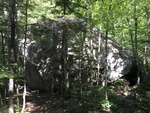 Tumbledown Rock is a large boulder along the Loop Trail; it may have been moved by glacial ice, but likely tumbled down from from bedrock exposures on Tumbledown Mountain.